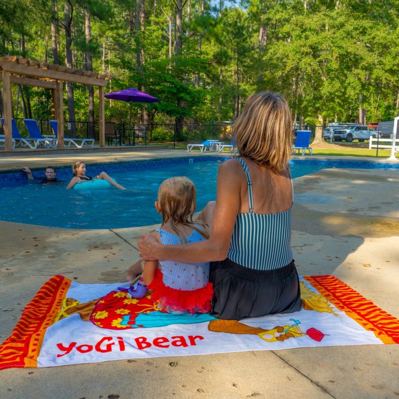 jellystone-cochran-ga-family-sitting-pool-deck-towel